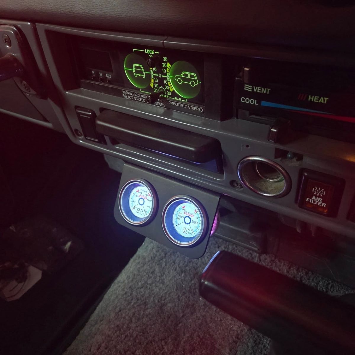 Gauge pod and inclinometer at night