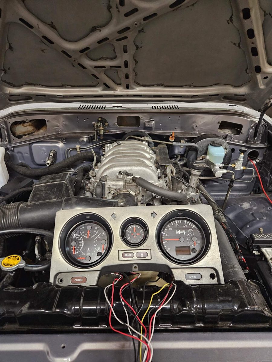 2UZ FE engine bay with LoTEQ gauge cluster and wiring