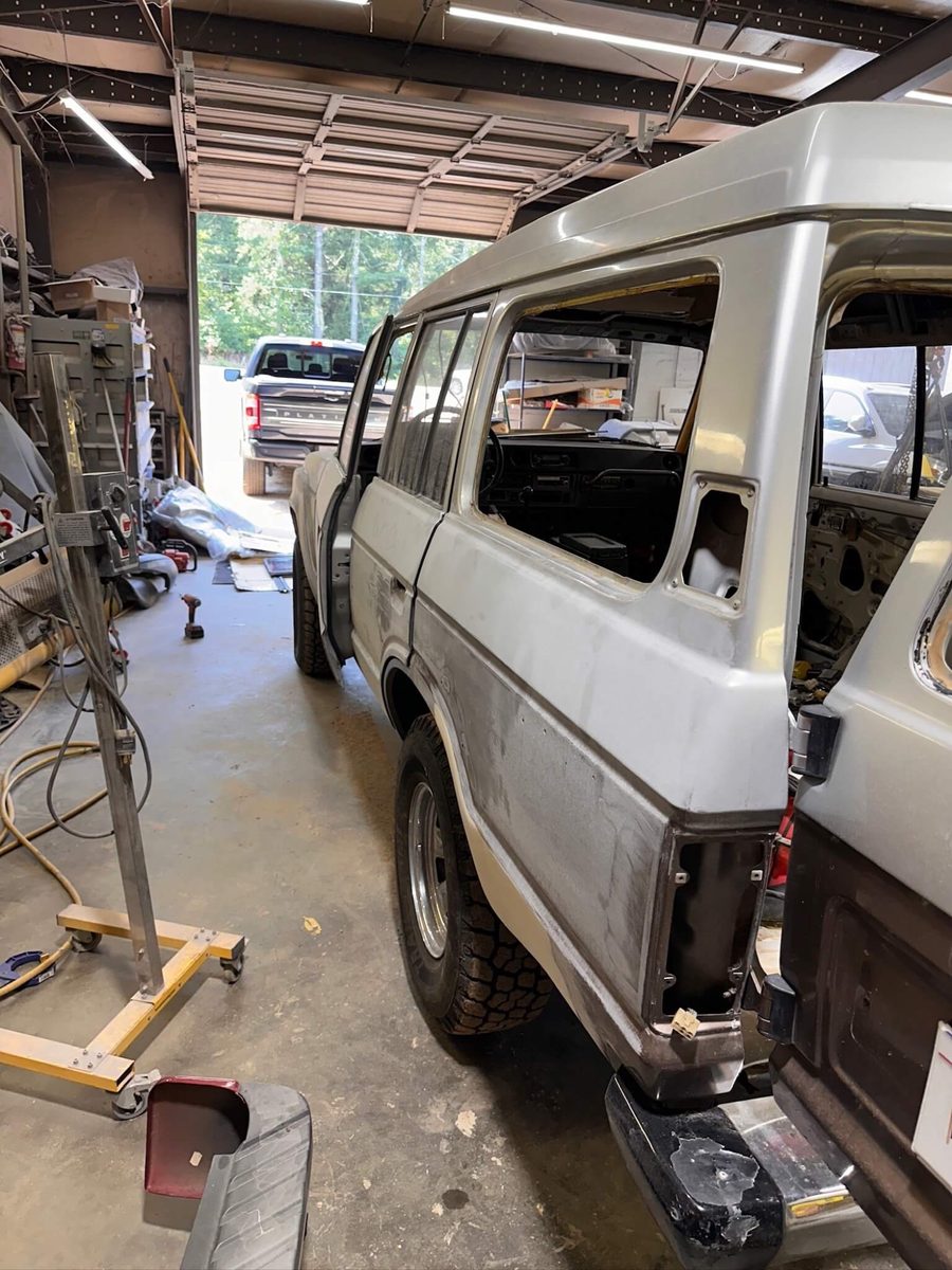 FJ62 rear quarter in body shop